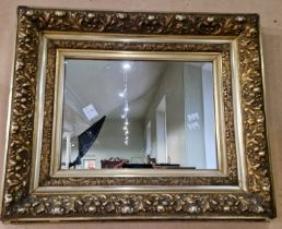 A gilt framed rectangular wall mirror, overall 52cm x 62cm.
