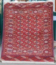 A Tekke rug, early 20th century, the rectangular field decorated with three rows of eight