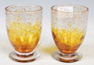 Two Monart glass tumblers, shape QC, mottled clear and yellow glass with gold coloured inclusions,