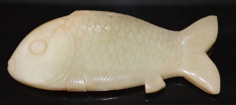 A Chinese carved russet jade model of a carp, 15.5cm long, 247 grams.