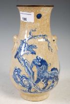 A Chinese porcelain crackle glaze blue and white pear-shaped vase, Qing Dynasty, decorated in