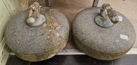 Two granite curling stones.