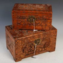A Chinese carved camphor wood storage box depicting figures in a townscape with koi carp, together