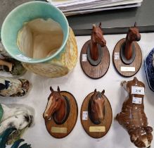 A group of Beswick to include an English bulldog figure, four Beswick horse busts mounted on