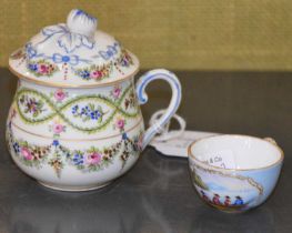 A Sevres porcelain chocolate cup and cover with painted floral garland detail, together with a