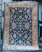 A Ziegler type blue ground rug, 20th century, with all-over decoration of stylis4ed flowers and