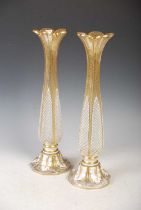 A pair of Bohemian opaque white and clear glass overlaid vases, the opaque white overlay with