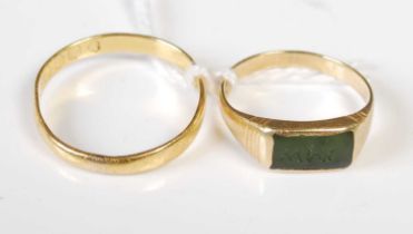 Two high carat yellow metal rings, one with green rectangular stone insert, gross weight 4.2 grams.