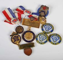 A collection of assorted medallions and badges to include 'British Legion of Scotland Conference