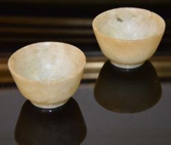 Two Chinese jade cups, approx. 5cm diameter x 3cm high, 73.8 grams.