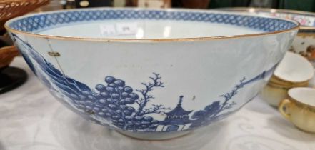 An 18th century Chinese blue and white porcelain bowl, the exterior decorated with pavillions in a