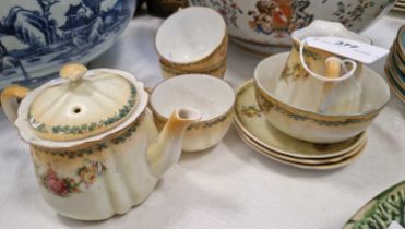 A Victorian part tea set, the off-white ground with yellow top decorated with roses, the underside