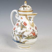 A Meissen porcelain hot water pot and cover, decorated in the 18th century palette with a