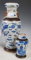 A Chinese porcelain crackle glaze blue and white two-handled vase, Qing Dynasty, decorated with