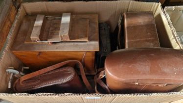 A box of assorted antique and later camera equipment, together with a cased set of binoculars.