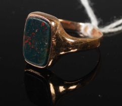 A yellow metal and bloodstone signet type ring, size R.