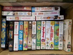 A box of assorted VHS tapes to include various cartoons such as 'Tom & Jerry', 'Bugs Bunny', 'The