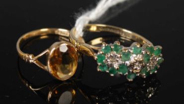 A 9ct gold, emerald and diamond chip flower cluster ring, together with a yellow metal dress ring