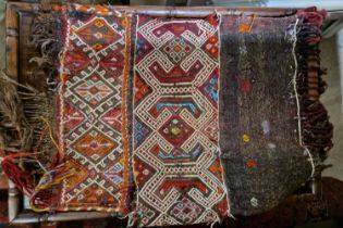 A Persian type bagface, worked in orange, madder, purple, blue and brown coloured threads,