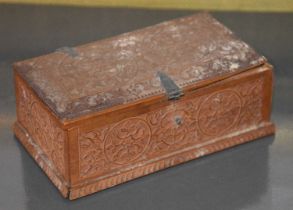 An Indian carved wood rectangular casket, decorated with roundels of flowers and foliage, 13cm wide.