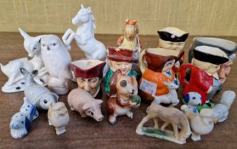 A collection of mixed ceramics to include various character jugs, a Hummel figure, Royal