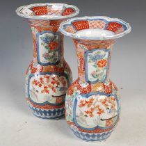 A near pair of Japanese Imari pattern vases, the undersides with six character mark, probably for Yi