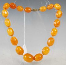 A vintage butterscotch amber graduated bead necklace, 61.1 grams.