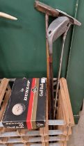 A group of four assorted vintage golf clubs comprising a Tom Auchterlonie St Andrews (patent