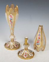 A pair of late 19th century Bohemian opaque white and clear glass overlaid vases, with polychrome