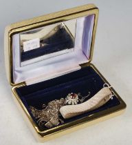 Costume jewellery box containing expandable white metal bracelets, various white metal necklaces,