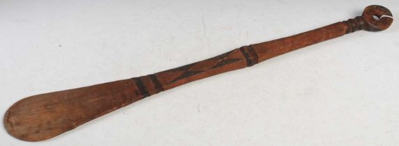 Tribal Art - An early 20th century African Tribal carved wood paddle / dance wand, with red and