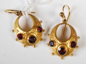 A pair of 9ct gold and garnet pendant earrings by Ivor Baggott, gross weight 3.4 grams.