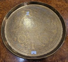An Indian brass metal table top / tray with details of lions and female figures.