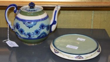 A Macintyre Moorcroft green ground teapot and cover, together with a Macintyre Moorcroft circular