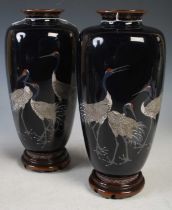 A pair of late 19th/ early 20th century Japanese silver wire work blue ground cloisonne vases in the