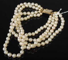 A vintage four strand pearl choker with 9ct gold clasp, gross weight 97.1 grams.