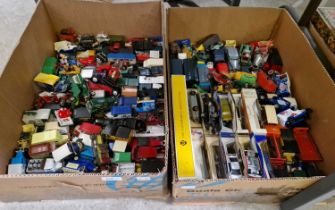 Two boxes of assorted die-cast and other model vehicles to include a Corgi Toys James Bond Astin