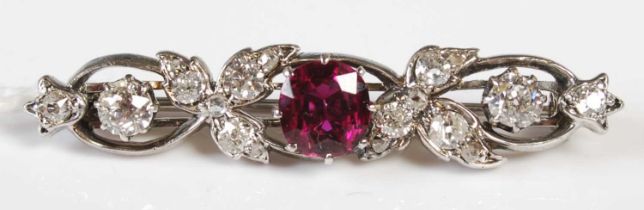 A late 19th / early 20th century white metal, ruby and diamond set brooch, set with one square