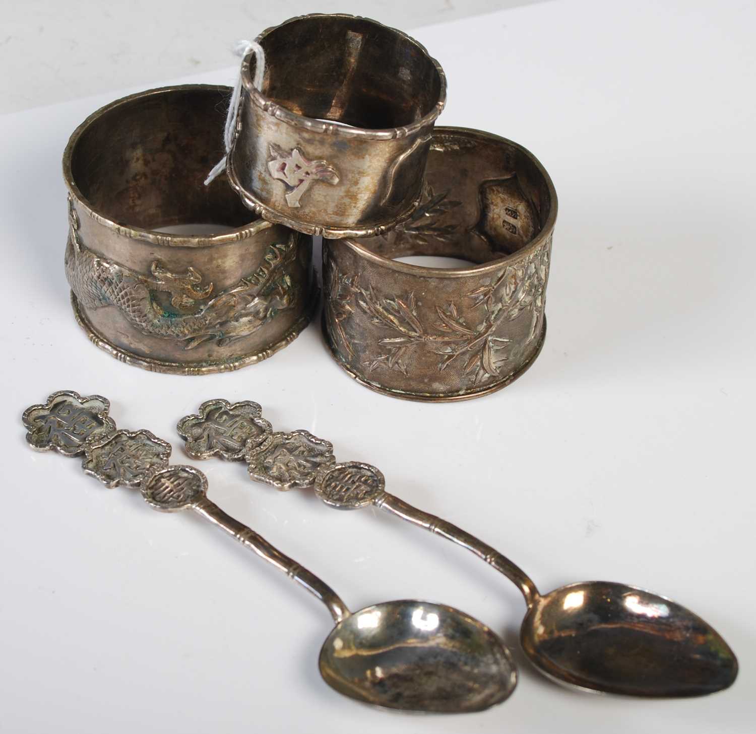 A collection of Chinese silver, late 19th / early 20th century, comprising three assorted napkin