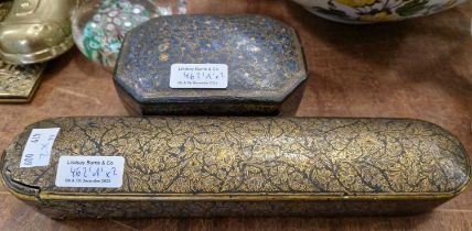 A Persian papier mache scribes box with gilded floral detail, together with a similar octagonal-