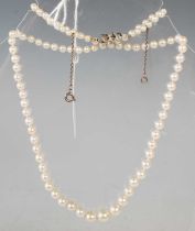 A vintage graduated pearl necklace with white metal clasp.