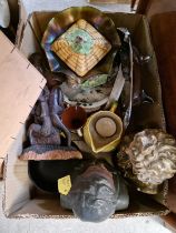 A box of mixed items to include figural busts, a carved African figure, a boxed ostrich egg,
