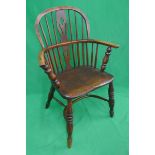 Early comb back elm seated armchair with crinoline stretcher