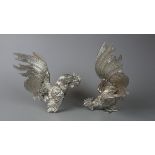 Pair of white metal fighting cockerels