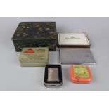 Collection of tins to include Zippo lighter
