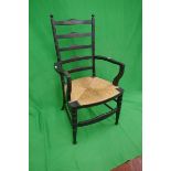 Arts & crafts ebonised armchair