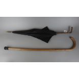 Antique parasol together with a walking stick