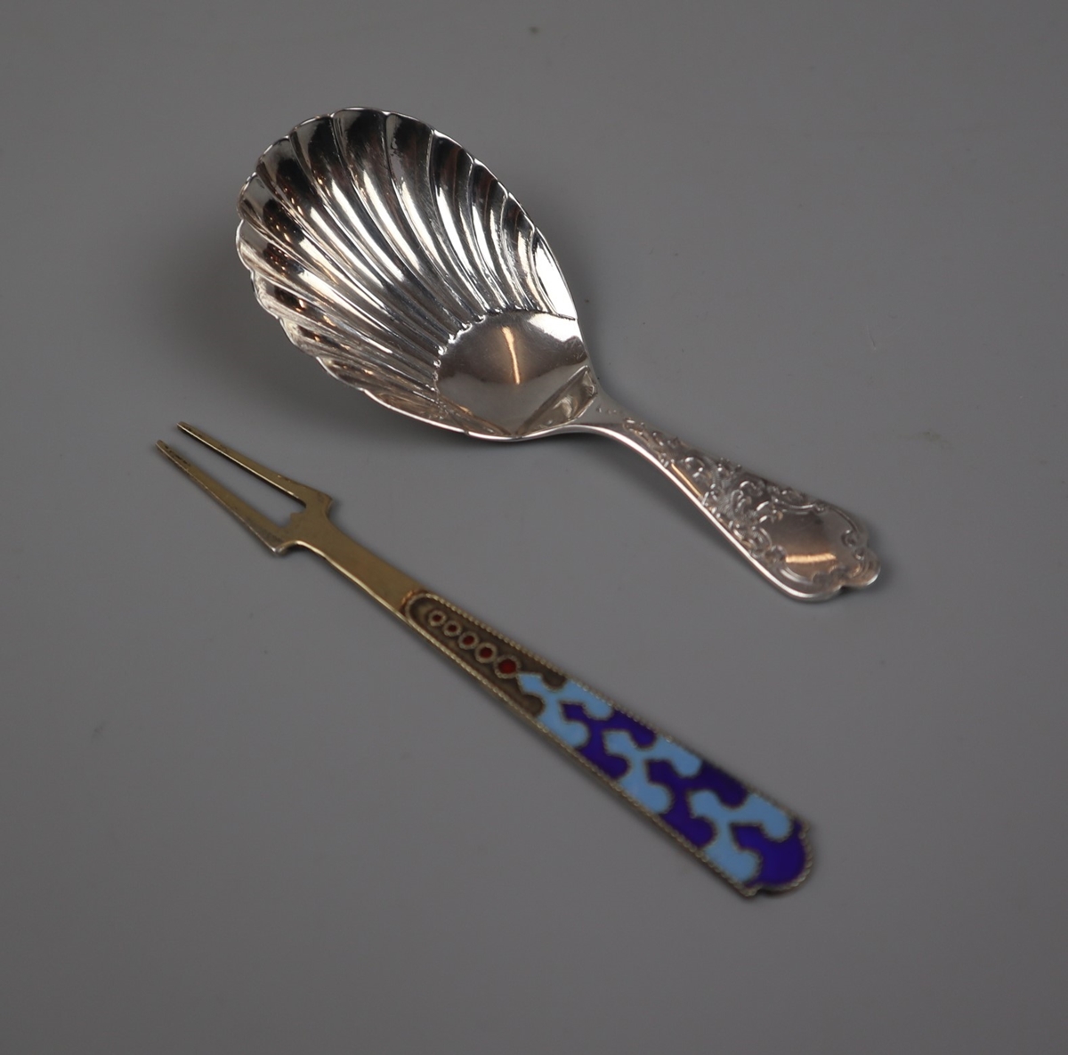 Victorian silver spoon together with a silver lemon fork