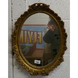 Gilt framed oval mirror