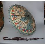 Antique hand painted parasol together with cane handled umbrella